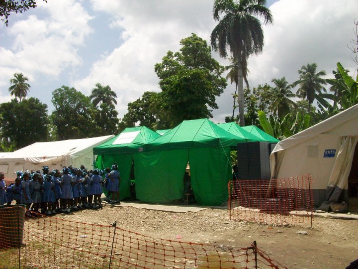 Relief tents and students at a school in Léogâne after the earthquake